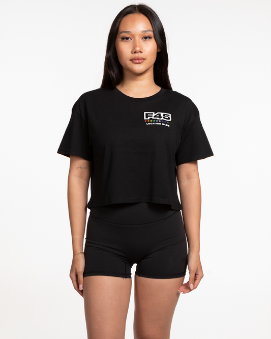 The Crop Tee - Black - Pride - Left Chest Stacked - Location - Back Center Vertical - Full Color